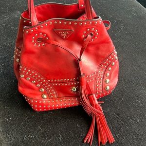 Authentic Prada bag. Like new condition. Red leather with silver studs.